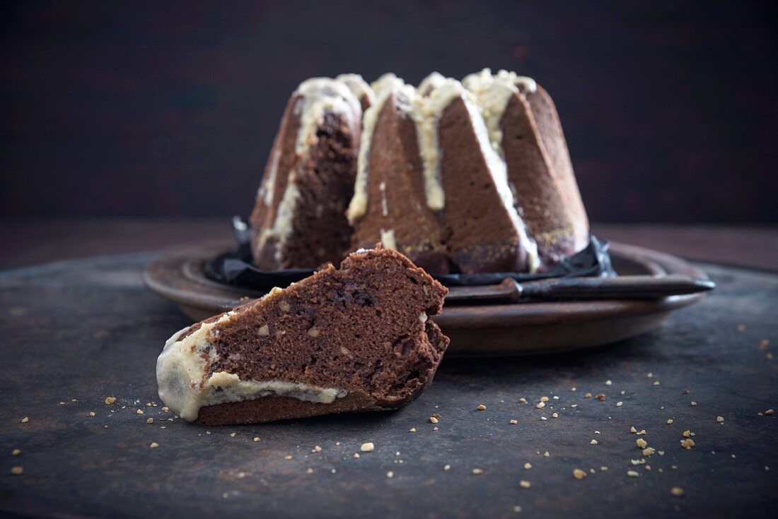 A vegan chocolate and almond gugelhupf with coffee cream frosting