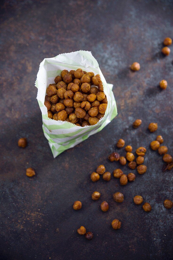 Roasted spicy chickpeas in a paper bag