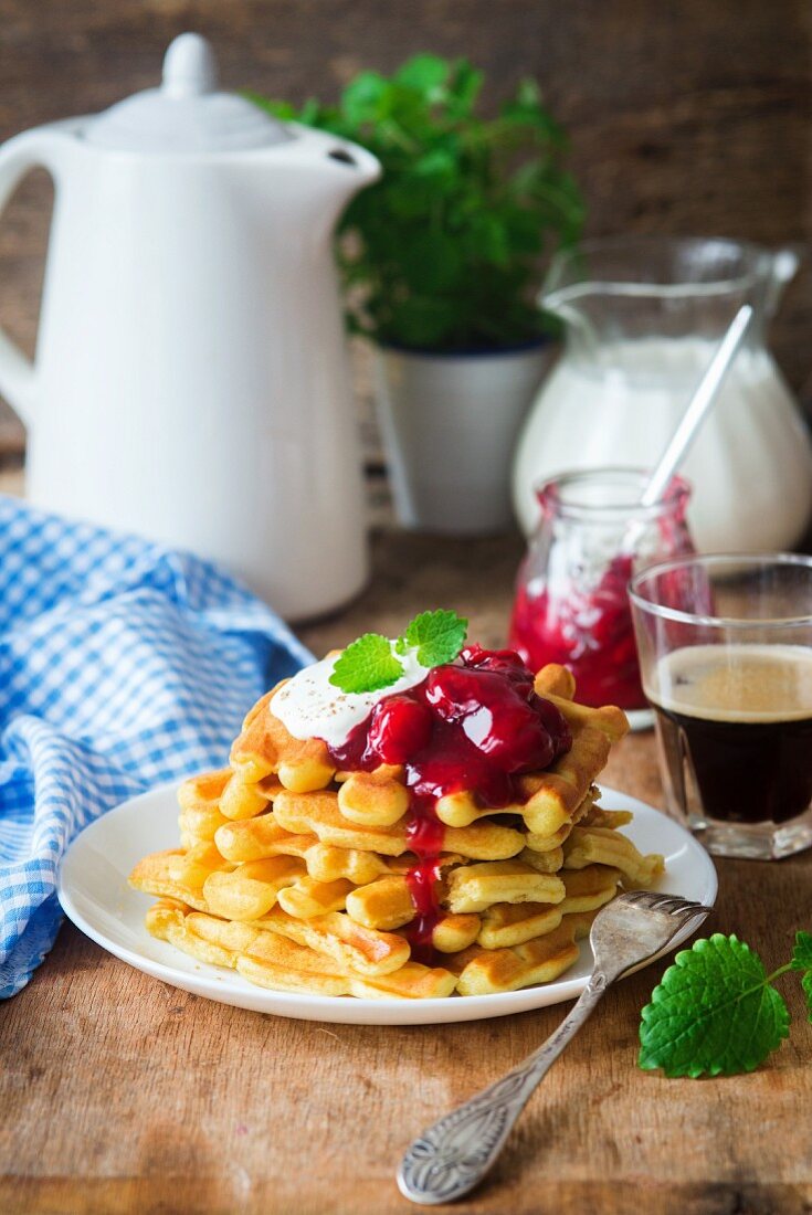 Waffles with cherry sauce