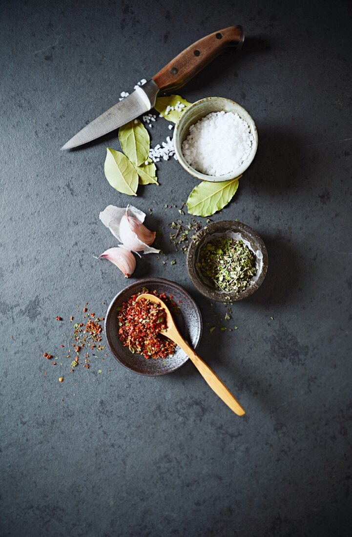 An Arrangement of Spices on a black stone surface