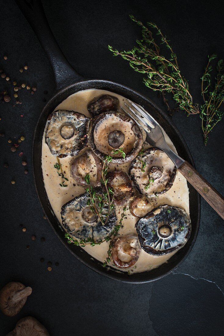 Mushrooms in creamy garlic sauce with herbs and peppercorns