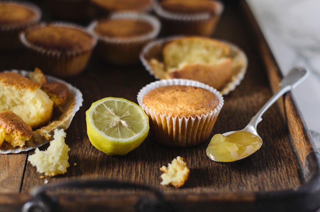 Lemon cupcakes on a wooden tray