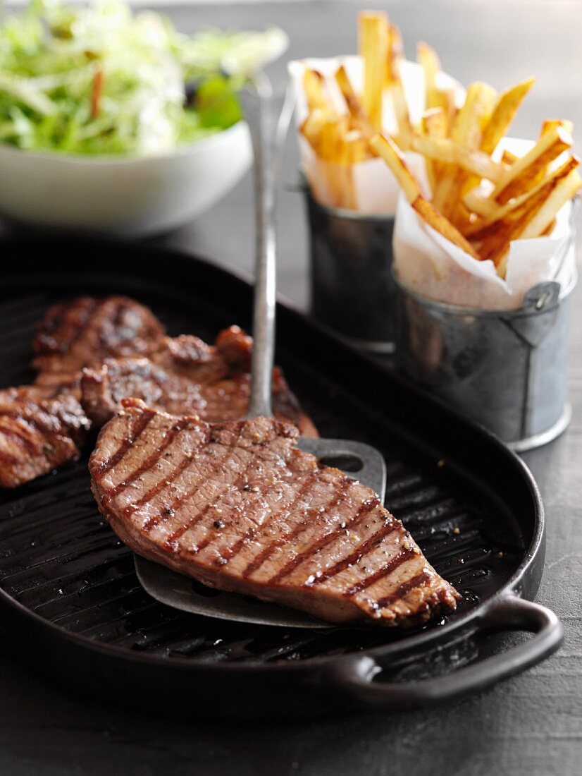 Minute steaks with fries and salad