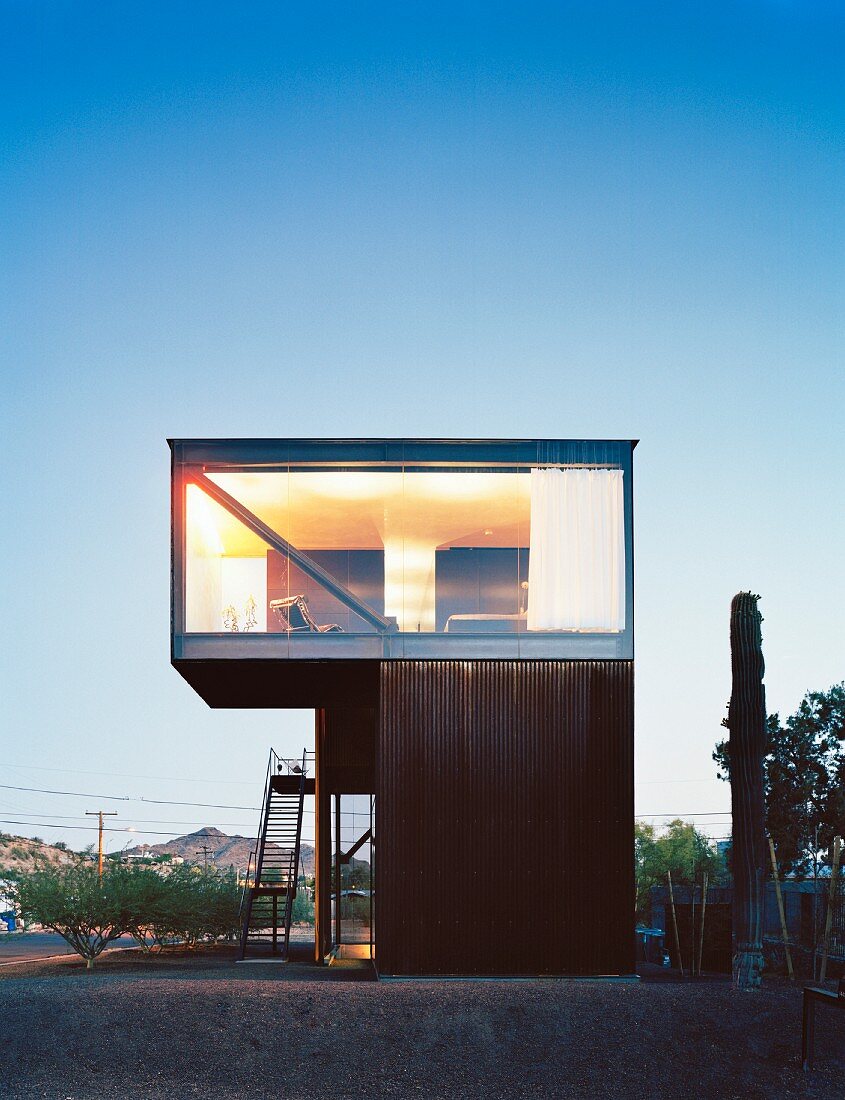 Cubist house with glass wall and exterior staircase