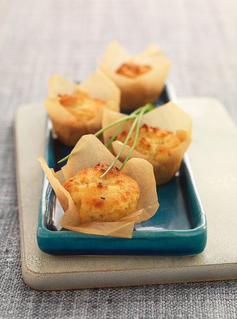 Savoury cheese and onion muffins in baking paper