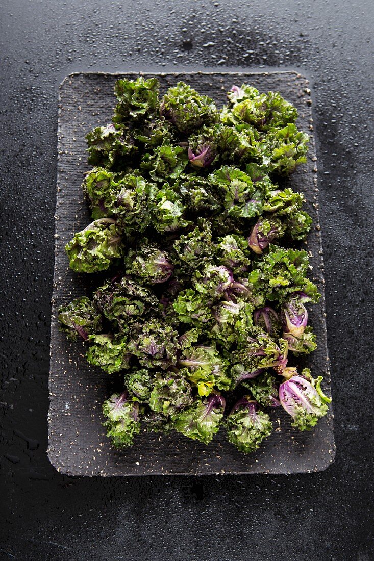Purple brussels sprouts on a tray