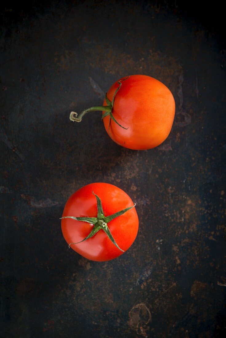 Two ripe vine tomatoes