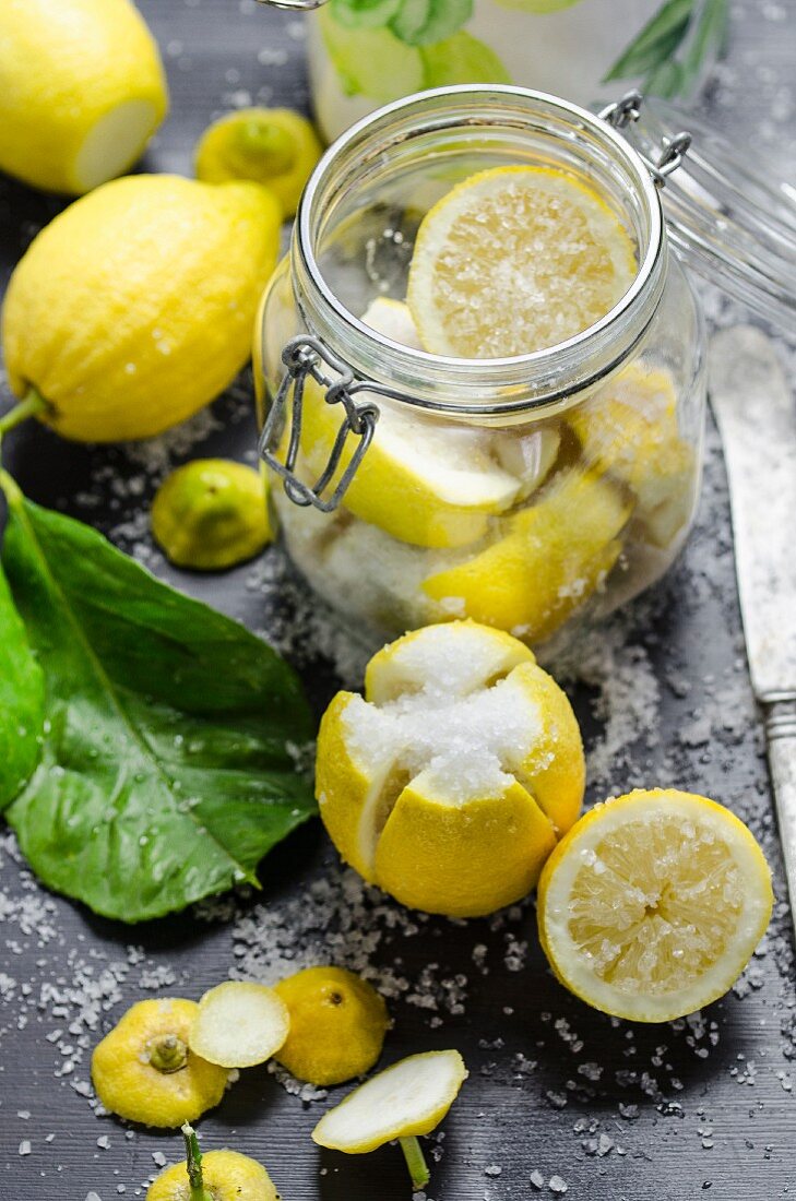 Lemons being soaked in salt
