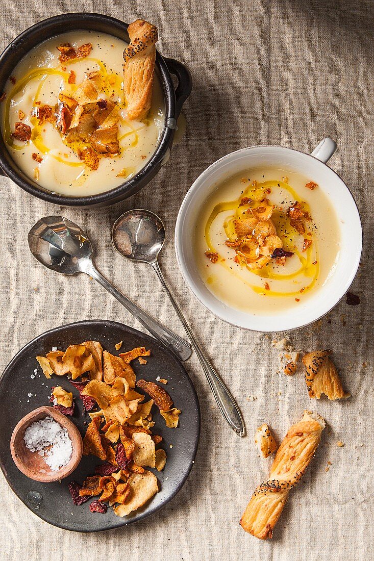 Parsnip cream soup with vegetable crisps (top view)