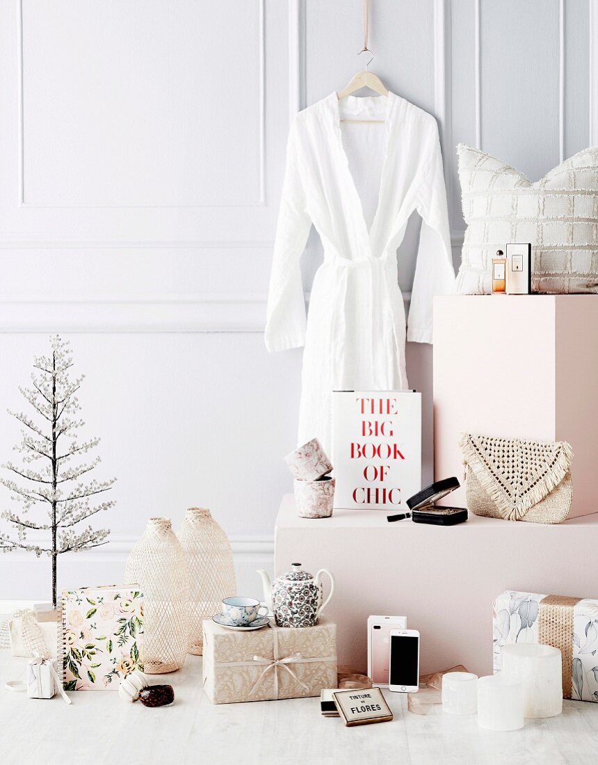 Feminine Christmas gift ideas in front of white wall