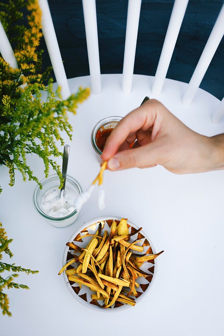 Girl holding parsnip fries