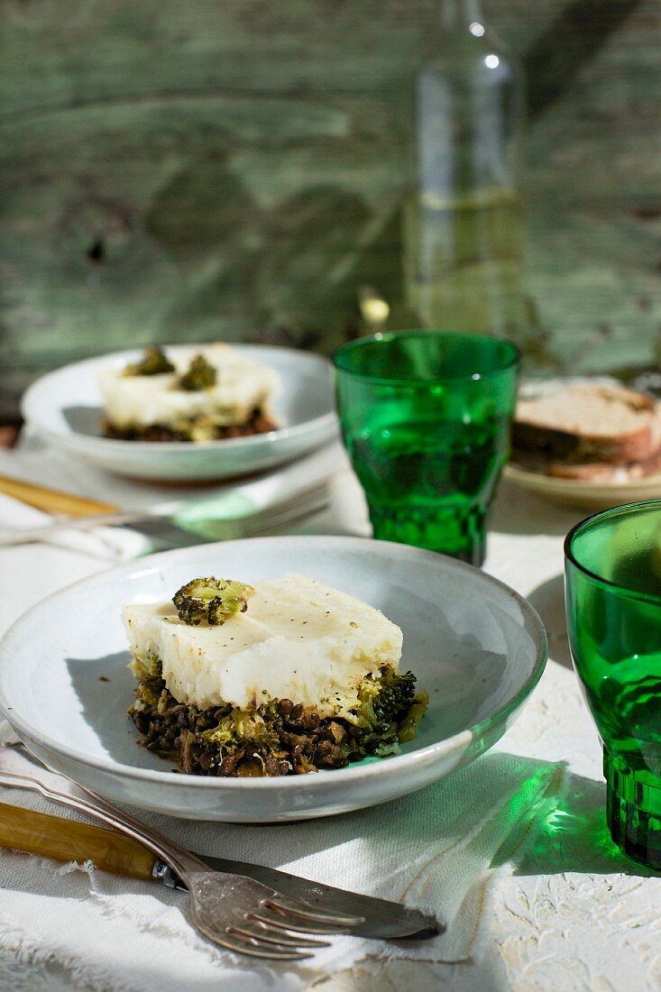 Black Lentil Charred Broccoli Shepherd s Pie served with bread and white wine