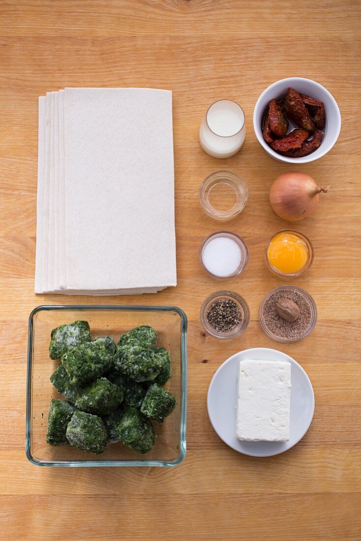 Ingredients for puff pastry parcels filled with spinach and sheep's cheese