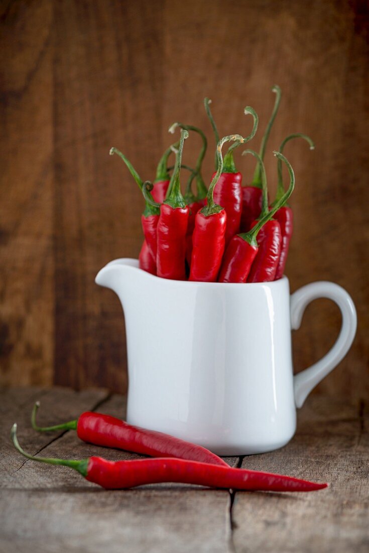 Fresh red chillies in a pitcher