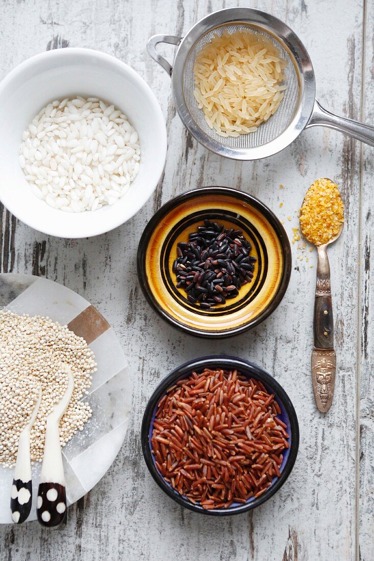 An arrangement of various types of rice, quinoa and couscous