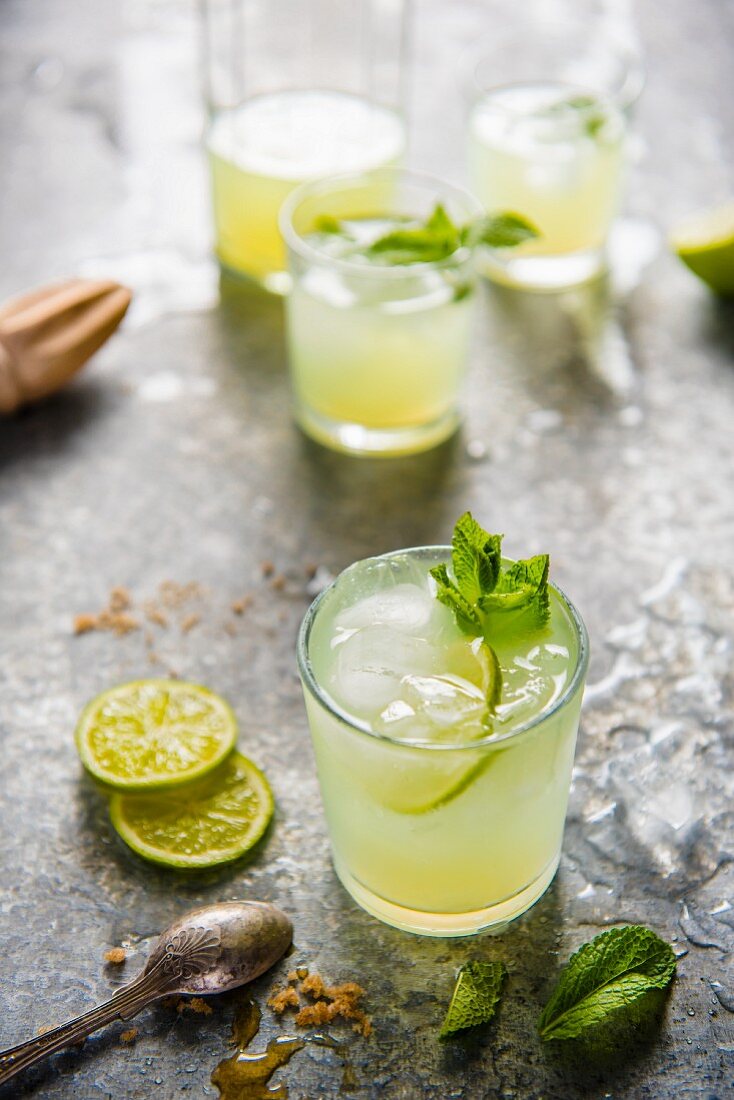 Freshly squeezed lemonade made with limes and brown sugar with a mint garnish