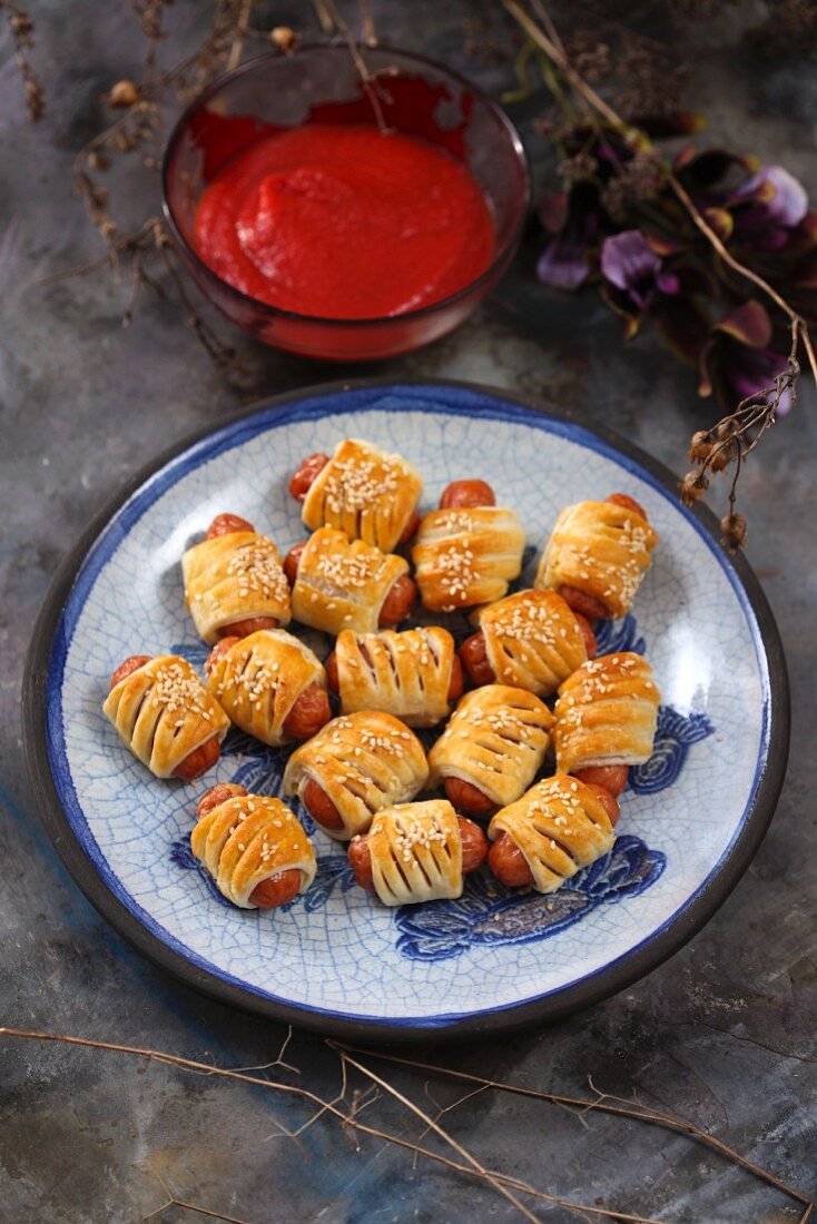 Sausage rolls with tomato dip
