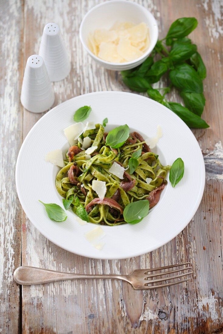 Green tagliatelle with anchovies, pesto and parmesan