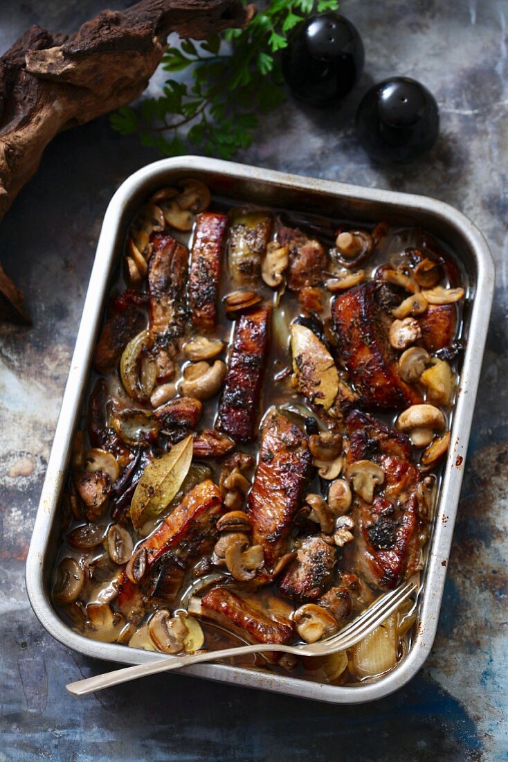 Spare ribs with mushrooms in a casserole dish