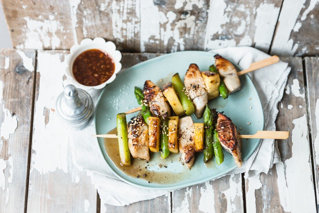 Fried asparagus and cod skewers with pineapple