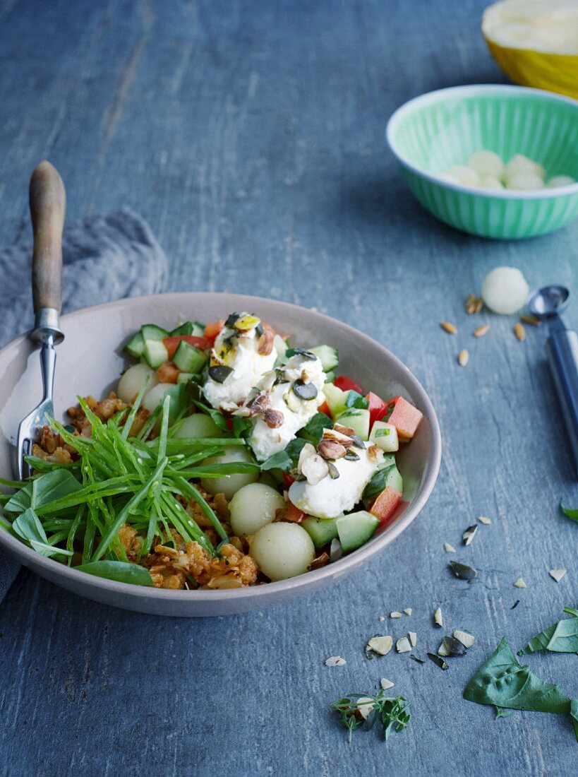 Cauliflower bowl with honeydew melon and nut and cream cheese quenelles