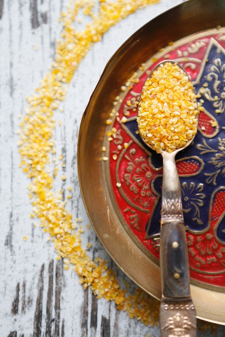 A spoonful of couscous on an oriental plate (seen from above)