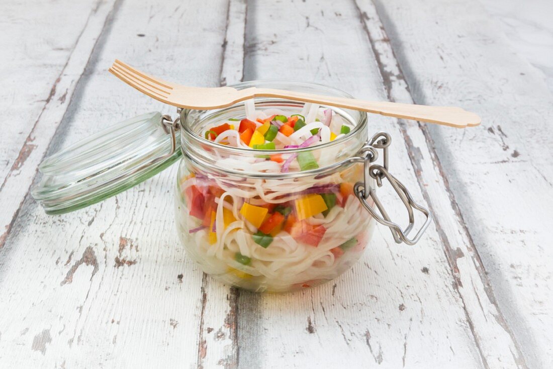 Glass noodle salad with yellow and red pepper, spring onion and red onion