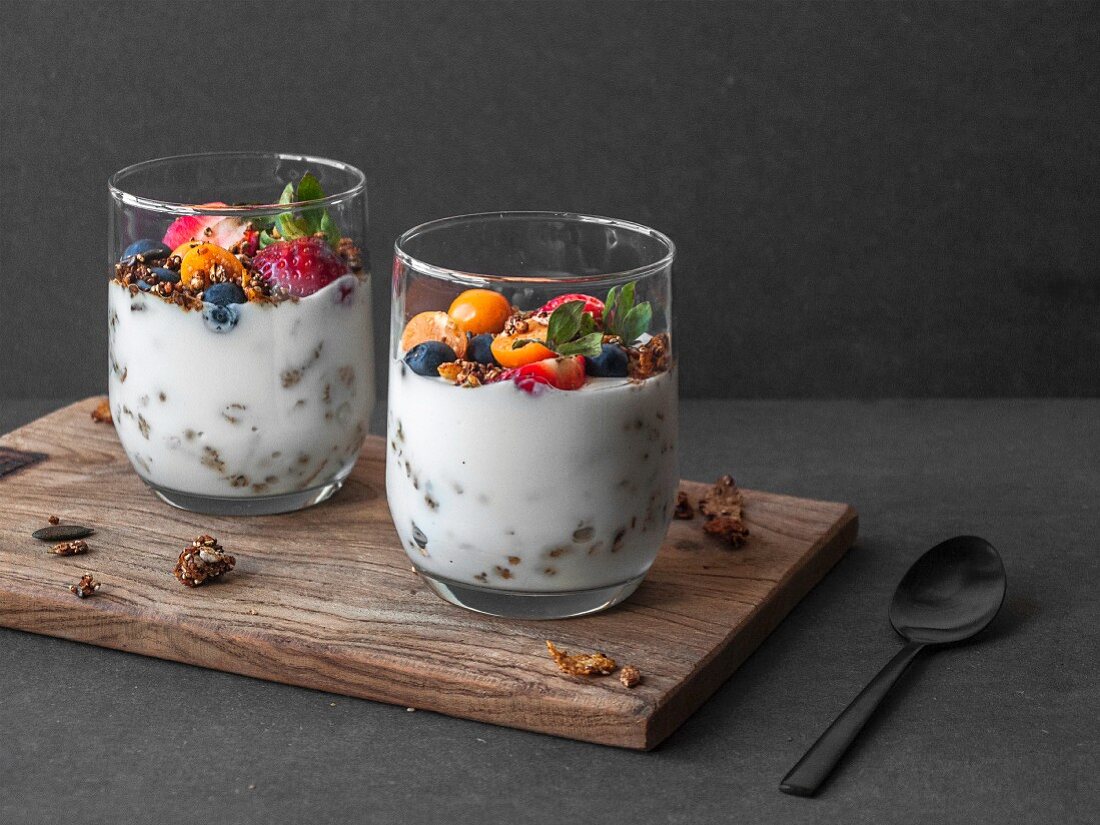 Yoghurt in a glass with gluten-free muesli and fresh fruits