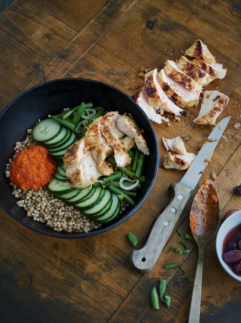 Lemon chicken bowl with buckwheat and red pepper sauce
