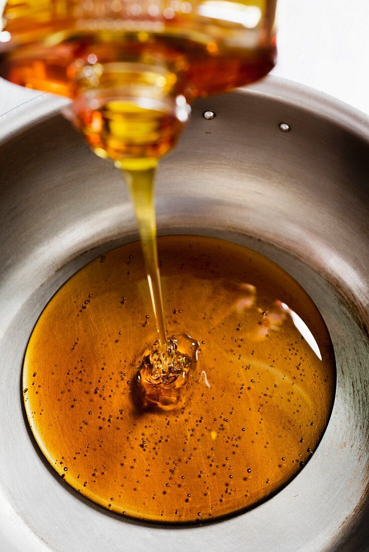 Syrup being poured into a bowl