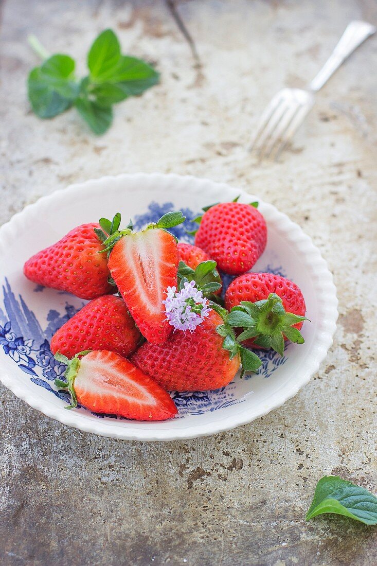 Fresh strawberries in a small dish