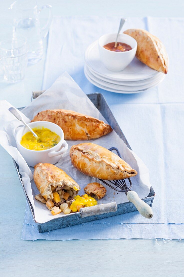 Cornish pasties with beef and vegetables, served with piccalilly chutney (England)