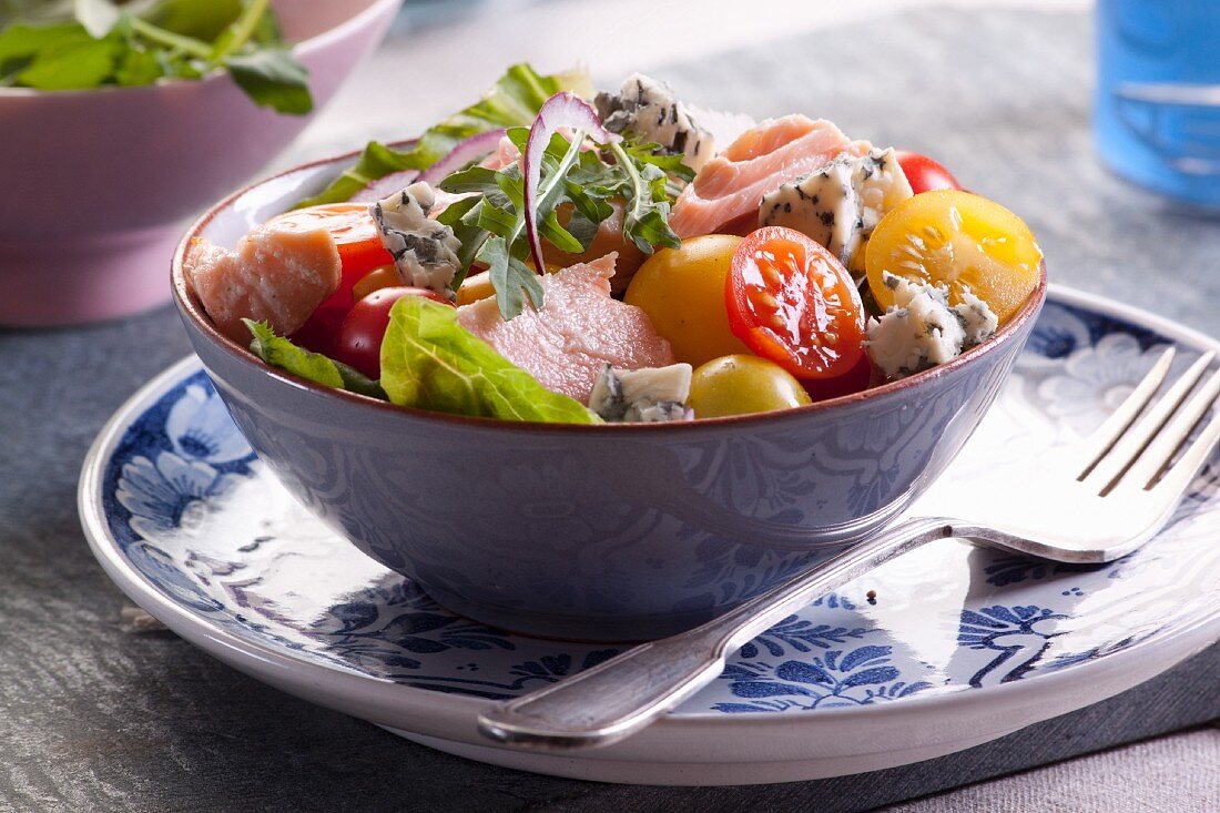 Salmon tomatoes and blue cheese salad