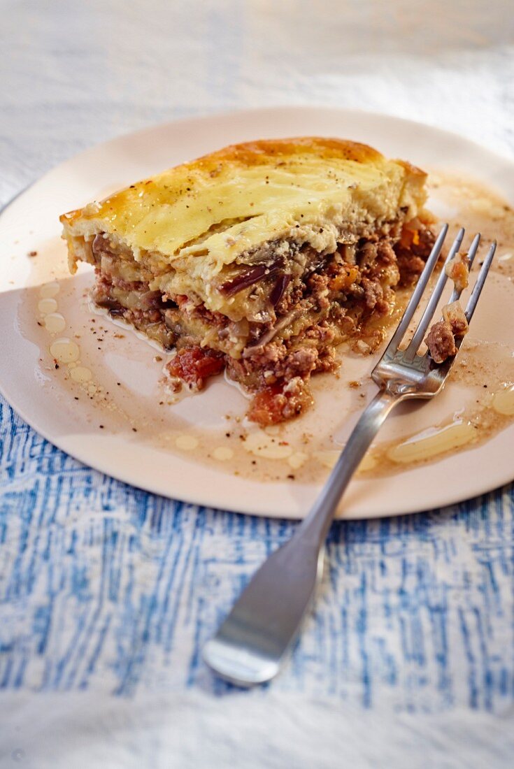 A slice of moussaka on a plate