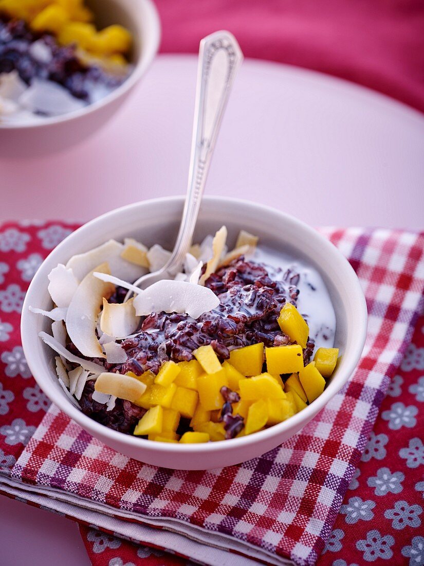 Black rice with coconut milk, mango and coconut chips