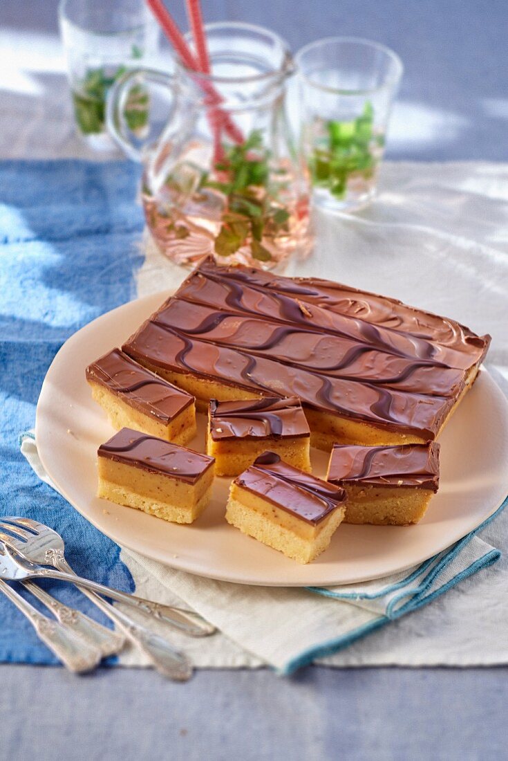 Shortbread with caramel and a chocolate glaze on a plate