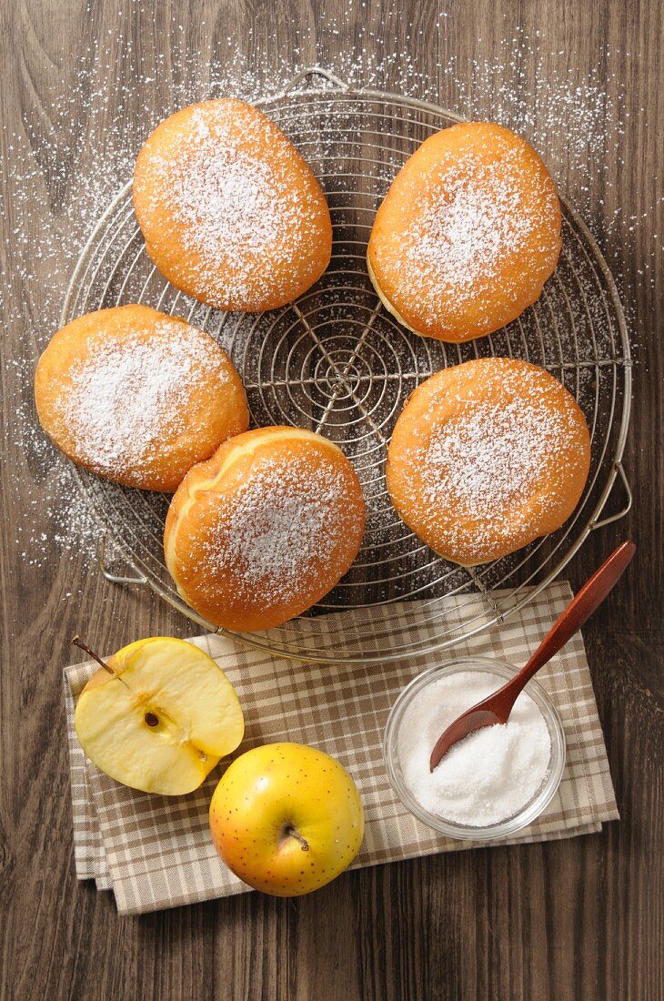 Apple doughnuts on a cooling rack