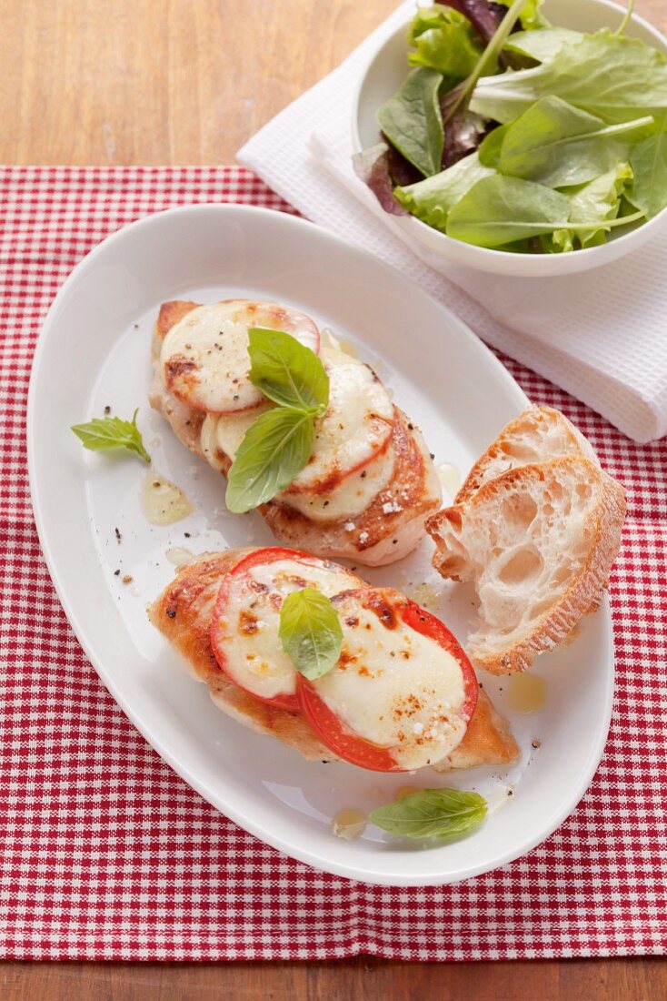 Oven-baked chicken breast with tomatoes and mozzarella