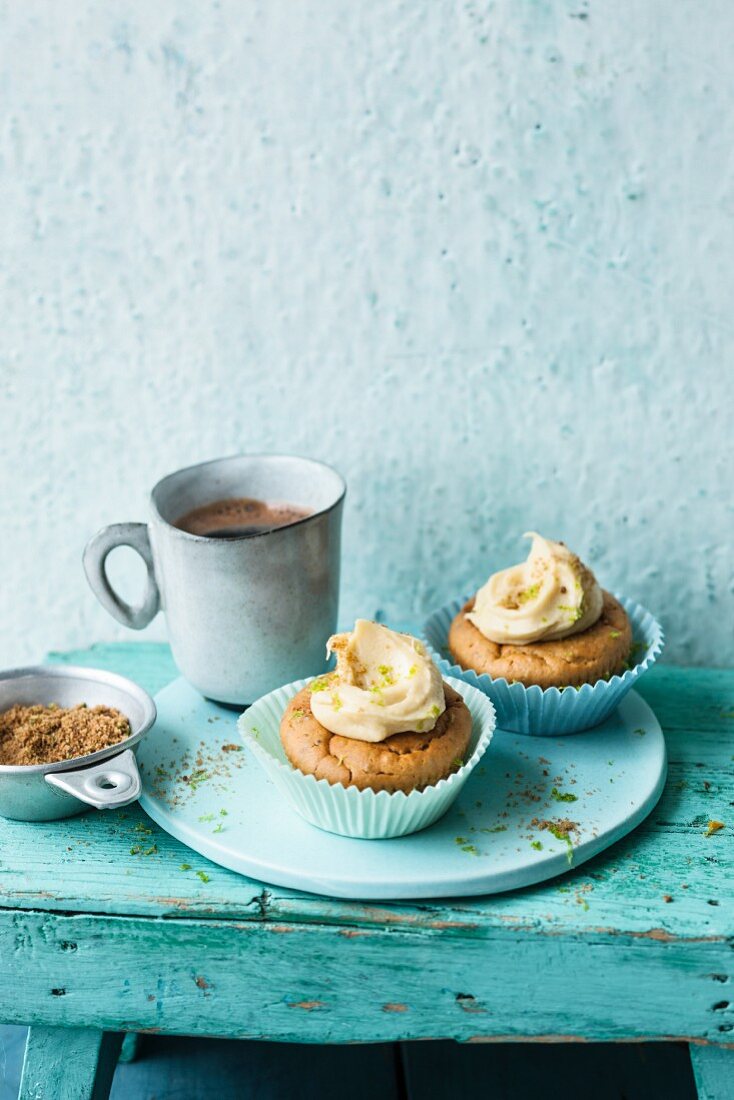 Lime and lupin cupcakes and a cup of coffee