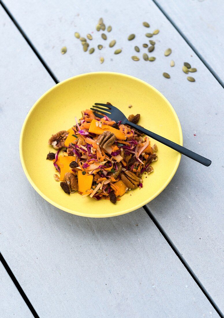 Pumpkin and red cabbage salad with orange and pecan nuts