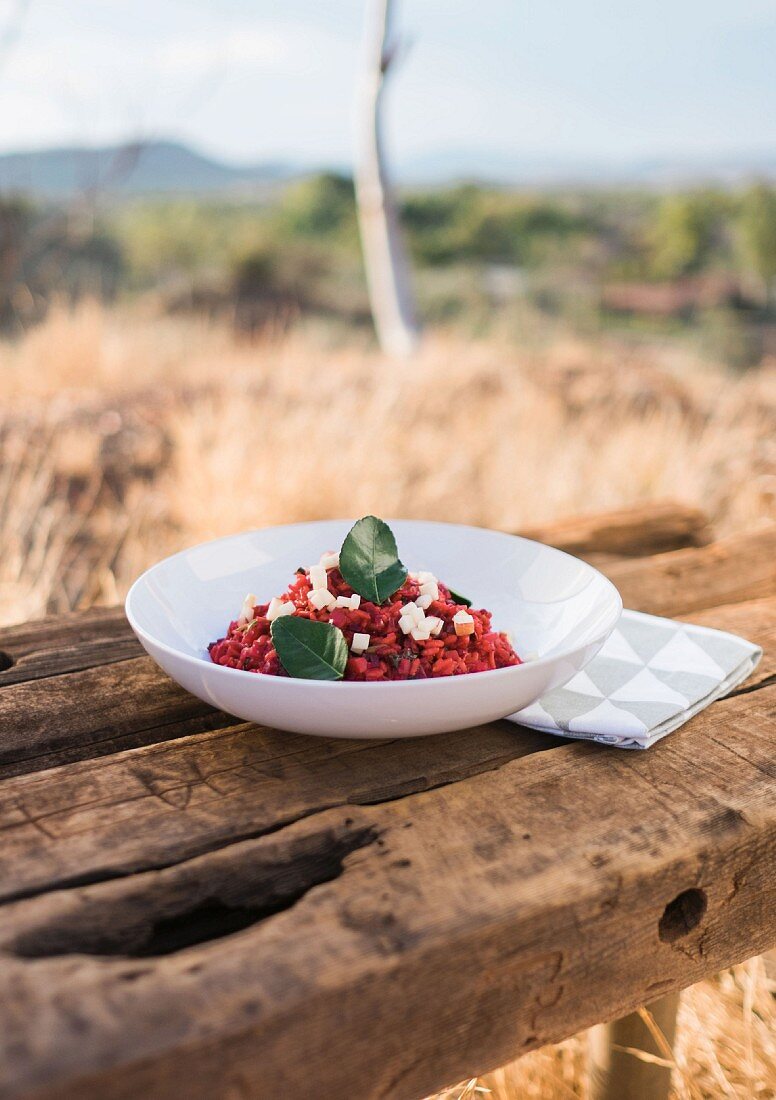 Beetroot risotto with apple and spring onion