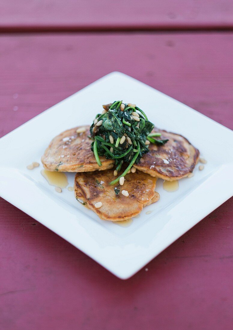 Tomato and basil pancakes with date spinach
