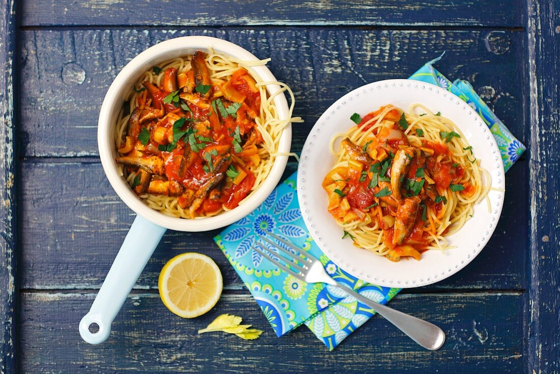 Spaghetti with tomato sauce, celery and sprats