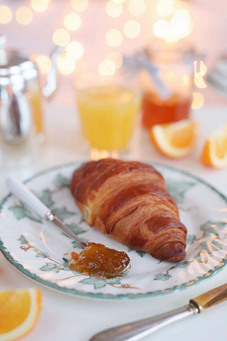 A croissant with orange marmalade