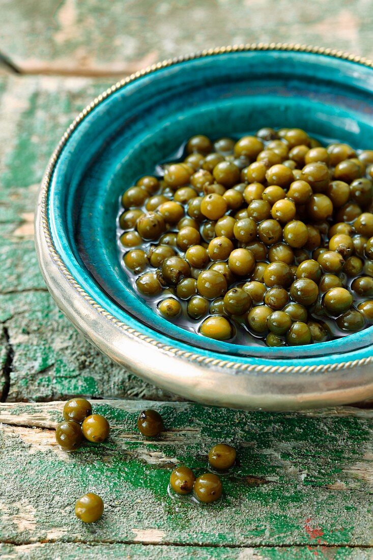 Pickled green peppercorns in a bowl