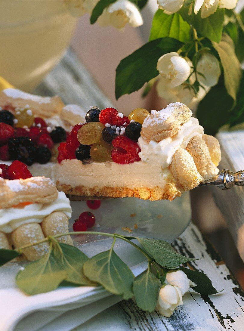 A piece of cheesecake with fruit & berries