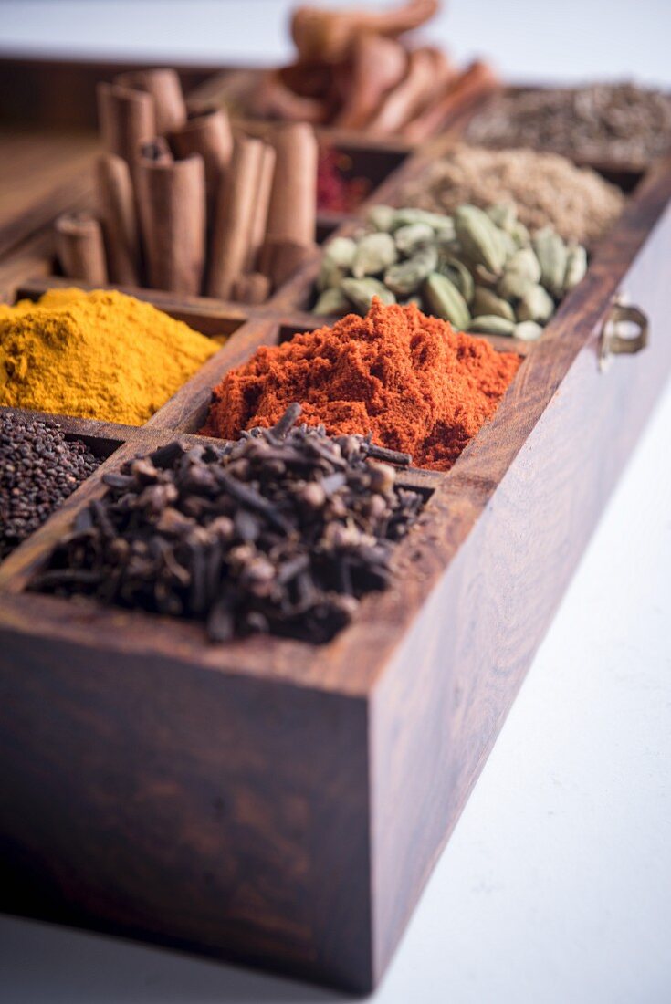 Various spices in a wooden box