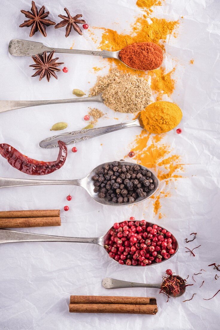 Various spices, some on spoons