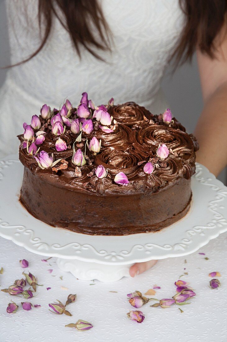 Chocolate mud cake decorated with dried rosebuds