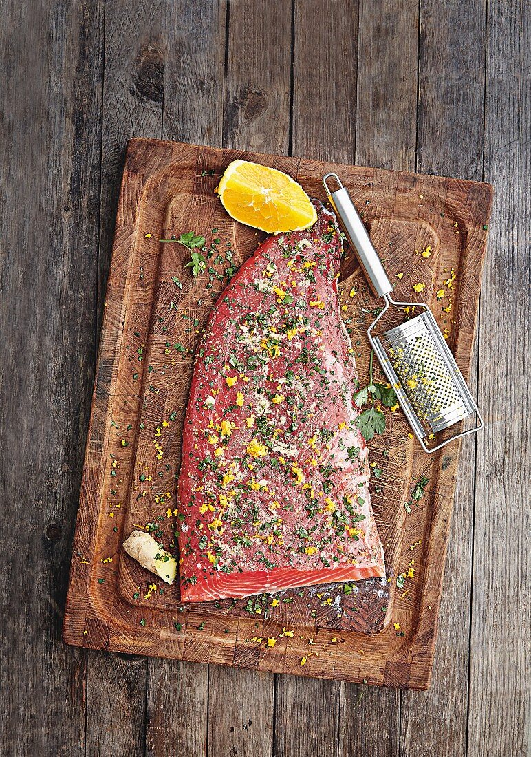 Fresh salmon with herbs, orange and spices